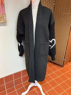 Black long line fleece with knitted sleeves with heart motifs